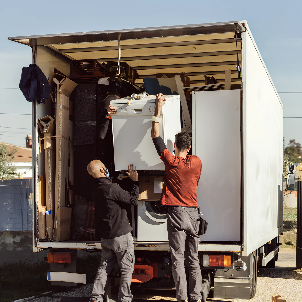 Image showing a crew lifting furniture and loading.
